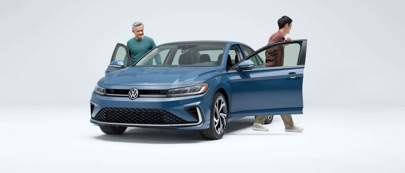 26 VW Jetta Exterior With Two People Exiting