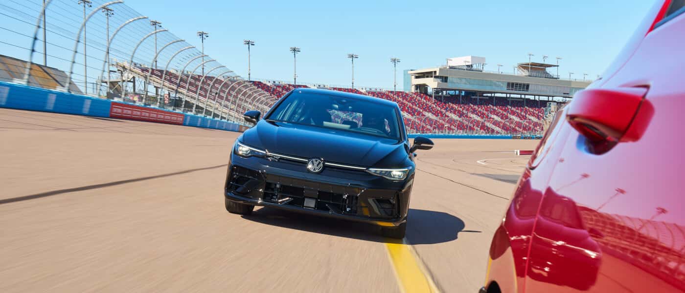 2026 VW Golf R Exterior Driving Behind Other Car
