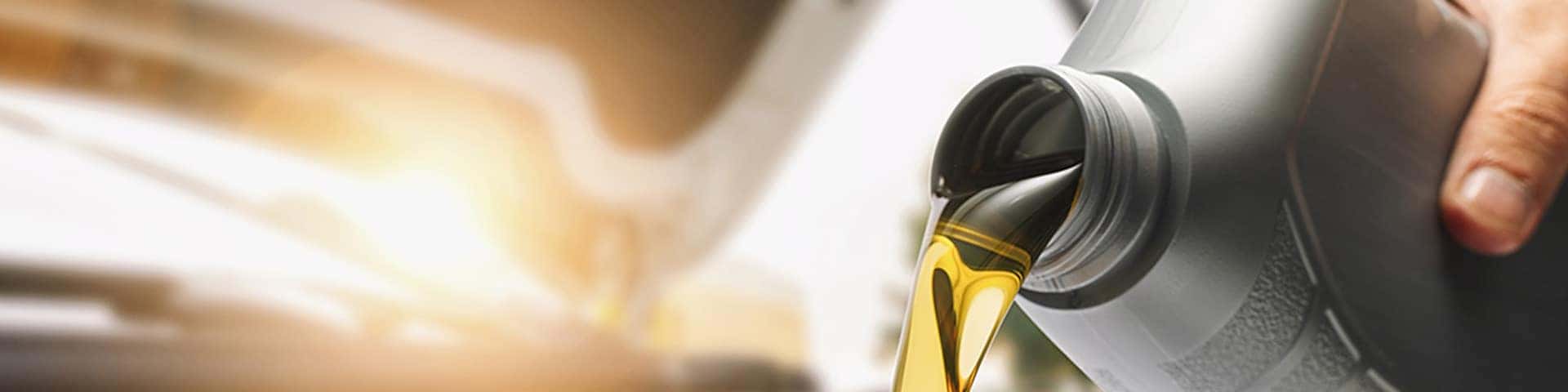 Close up view of engine oil being poured