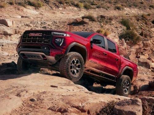 2024 GMC Canyon AT4 offroading over rocky terrain