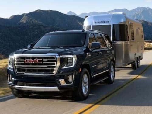 2024 GMC Yukon Denali towing an airstream