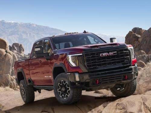 2024 GMC Sierra HD AT4 parked in a rocky terrain