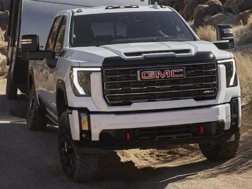2024 GMC Sierra HD AT4 towing a camper