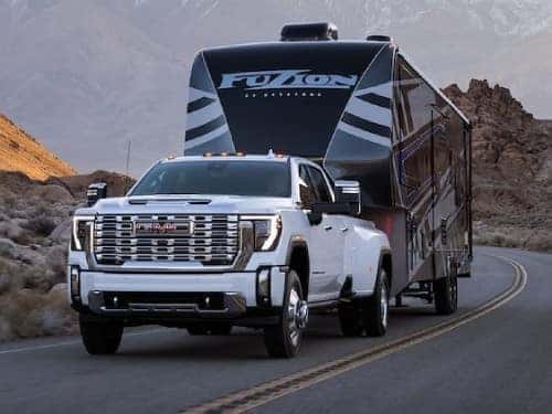 2025 GMC Sierra HD Denali towing an RV