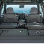 Interior cargo space of a 2026 GMC Acadia with second and third-row seats folded flat.