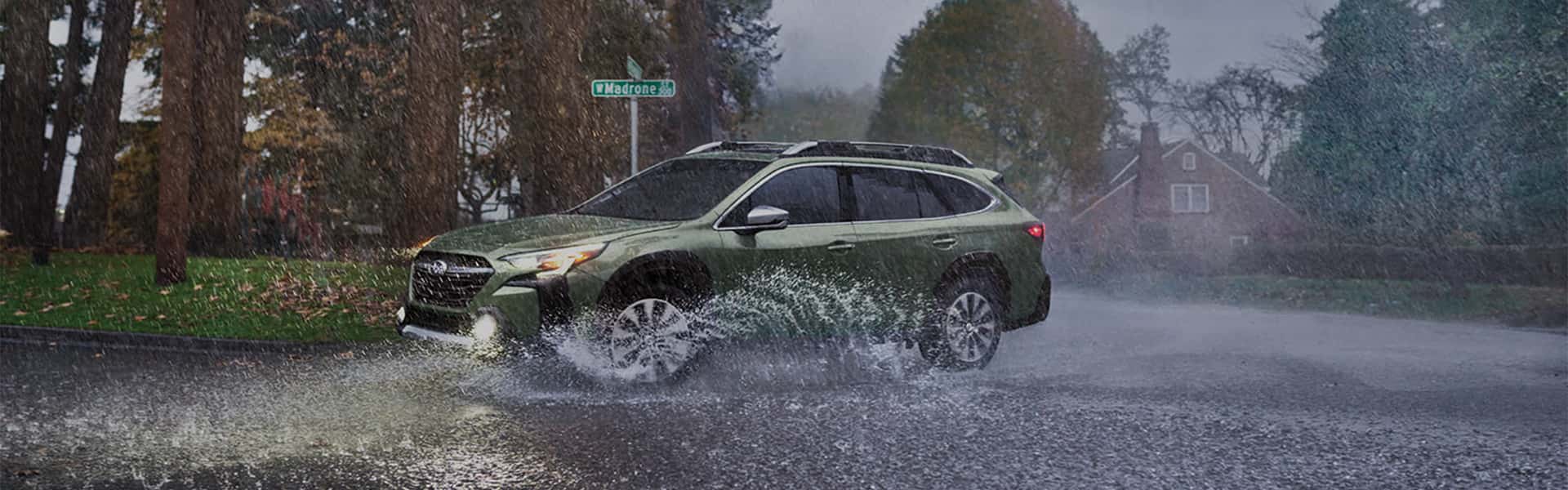A Subaru in the rain
